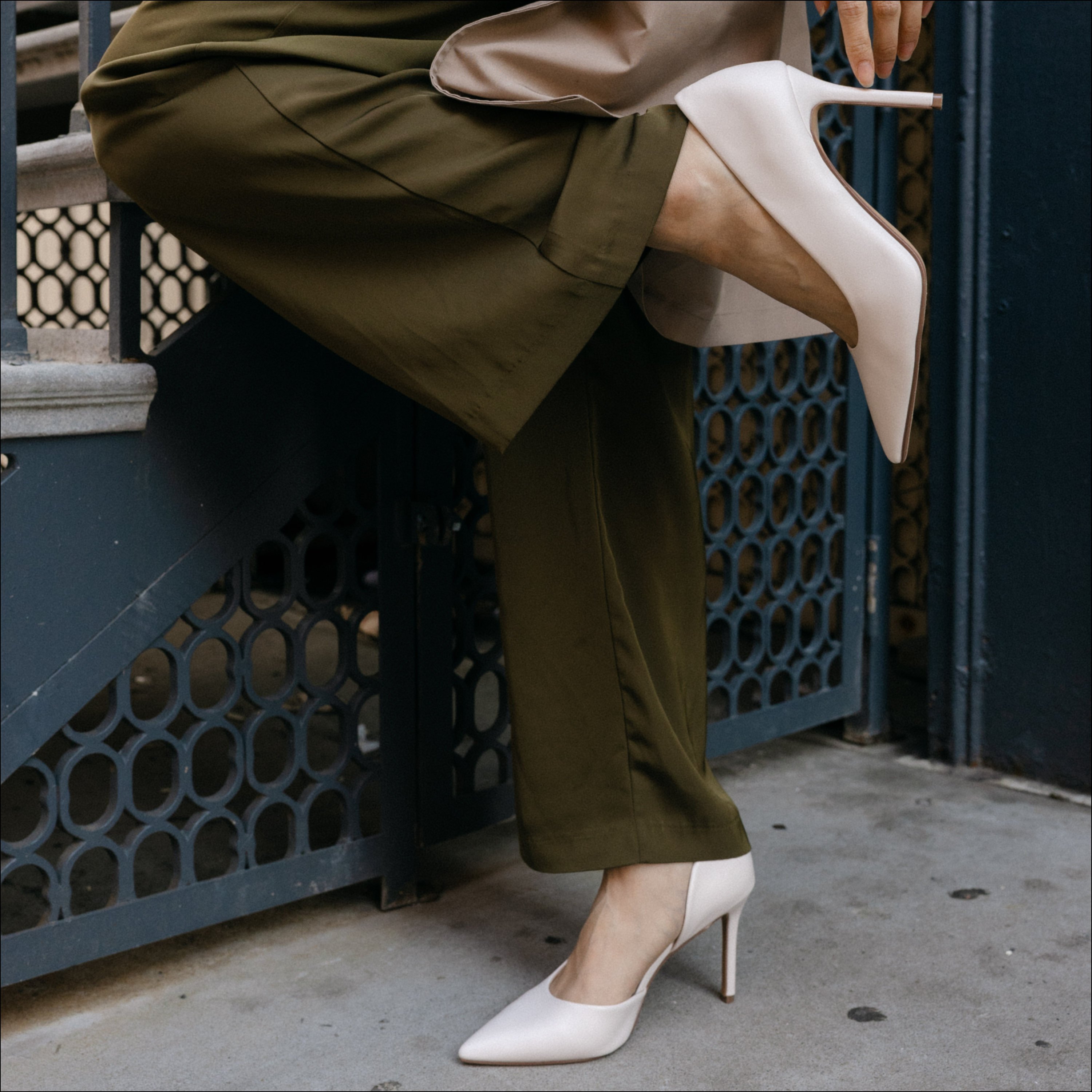 Promotional graphic with beige background and white text reading "Boots $100 and Under"