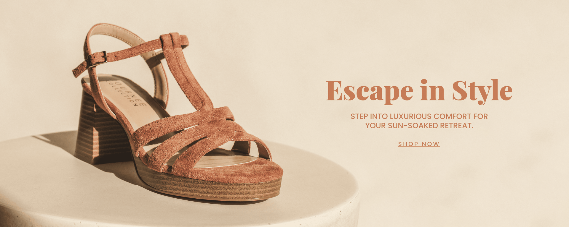 "Escape in Style" text header in a cognac font with a "step into luxurious comfort for your sun soaked retreat. " sub header. A faux suede strappy sandal with a stacked block heel is in focus. "Shop now" call to action.