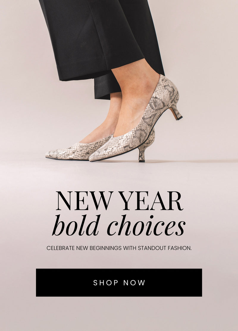 Grey snake pump heels on a model with black dress pants. Text reads "New Year, Bold Choices." CTA button reads "SHOP NOW"